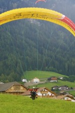 The paragliding landing in Alpe di Siusi (Seiser Alm), Italy