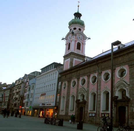 A pink historic church in Innsbruck, Austria is just one of many romantic buildings found in the old town. A pink historic church in Innsbruck, Austria is just one of many romantic buildings found in the old town.