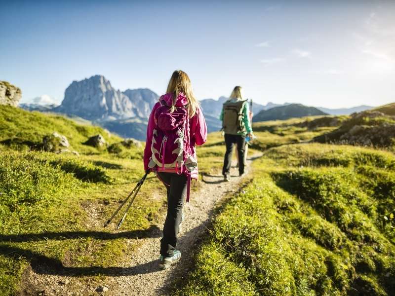 women hiking in a mountain trail
