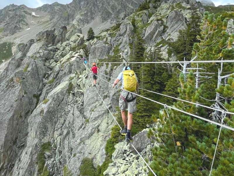 climber walking in an "iron path" or the via ferrata near chamonix