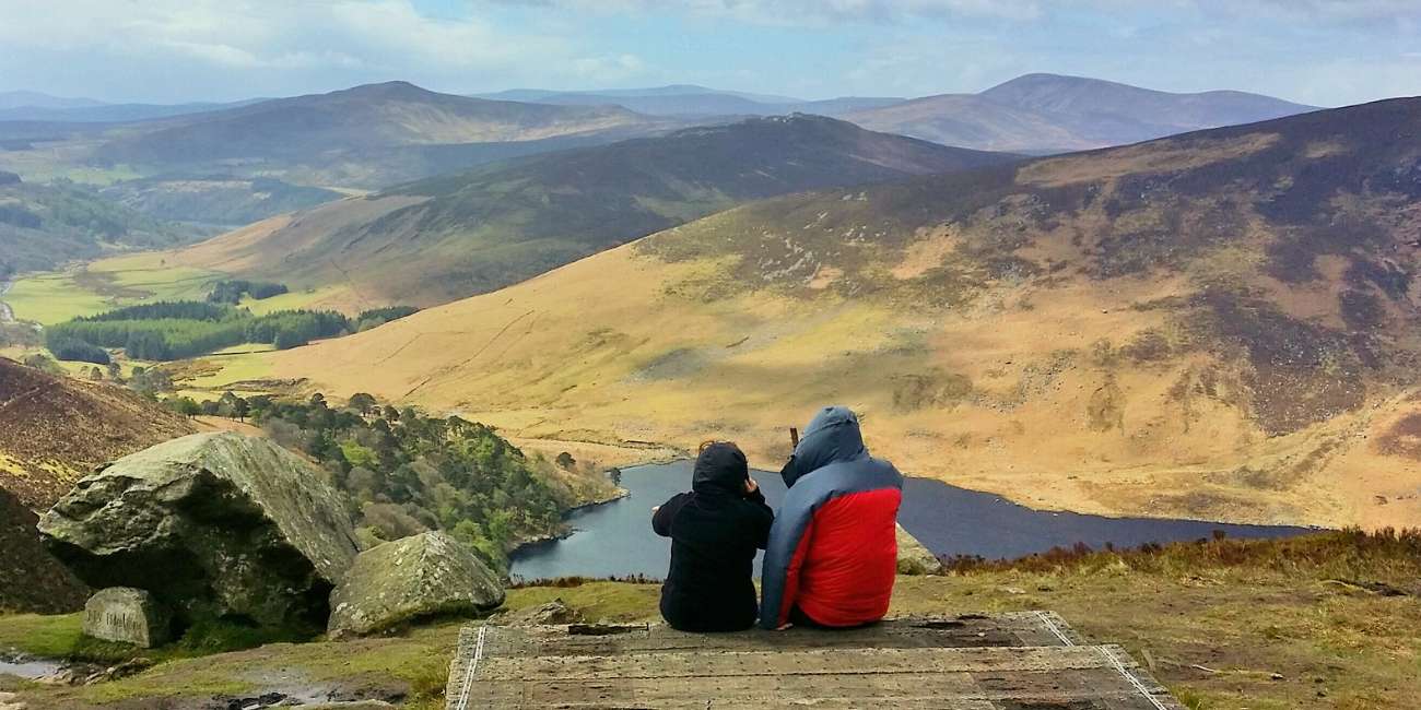 couple hiker near the lake in wicklow way trail