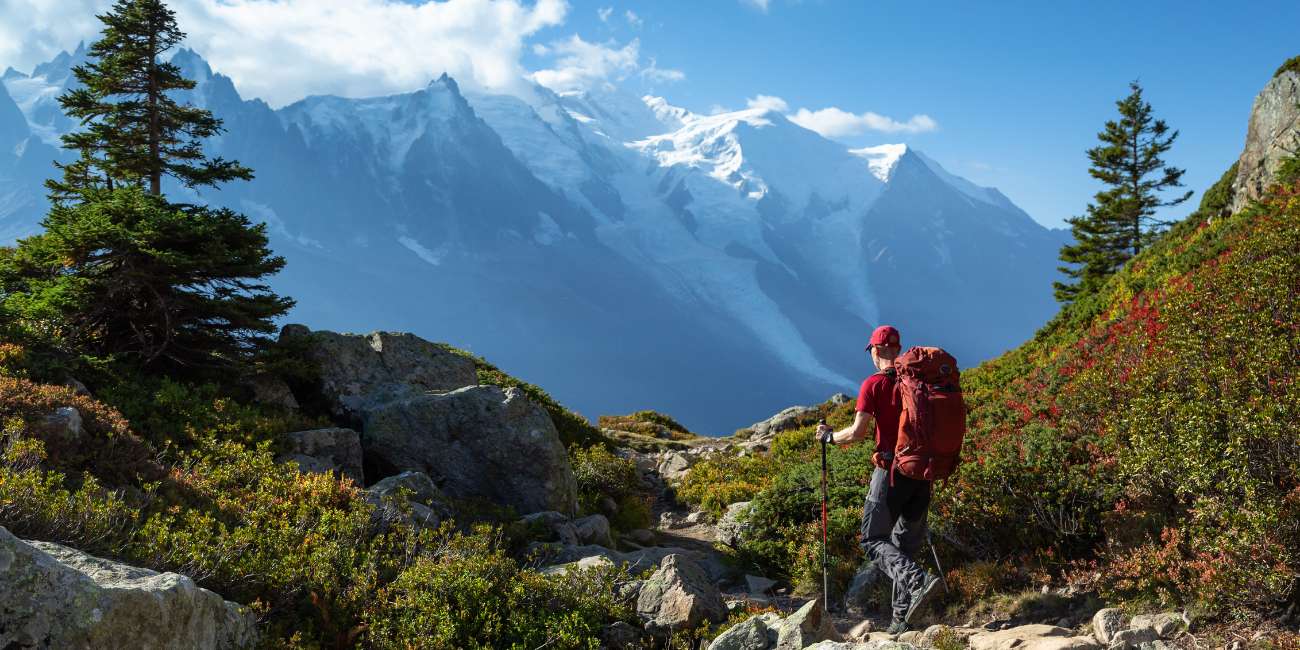 hiker with mont blanc mountain views