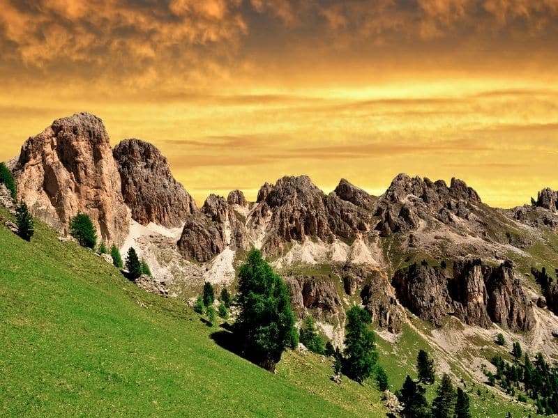 The Rosengarten massif glowing red at dusk in the enrosadira alpenglow, Dolomites, Italy