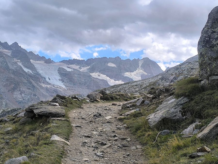 Gran Paradiso hiking trail running below the glaciers in the Italian Alps