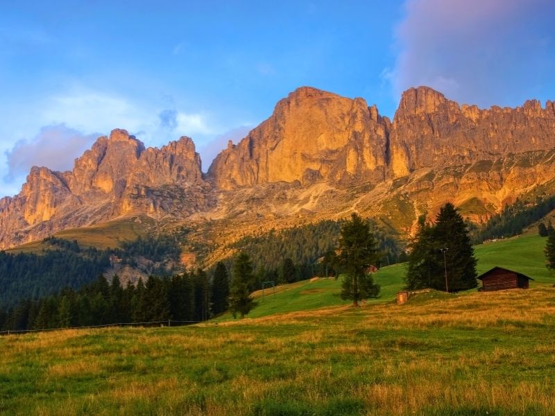Sunset over the Rosengarten massif in the Dolomites, seen on the Seiser Alm to Rosengarten self-guided hiking tour