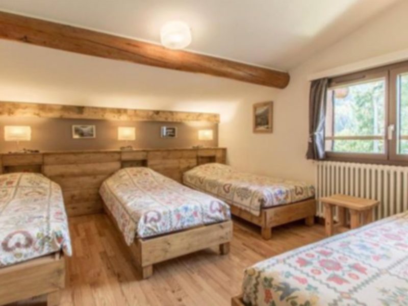 Dormitory room with single beds on the Tour du Mont Blanc