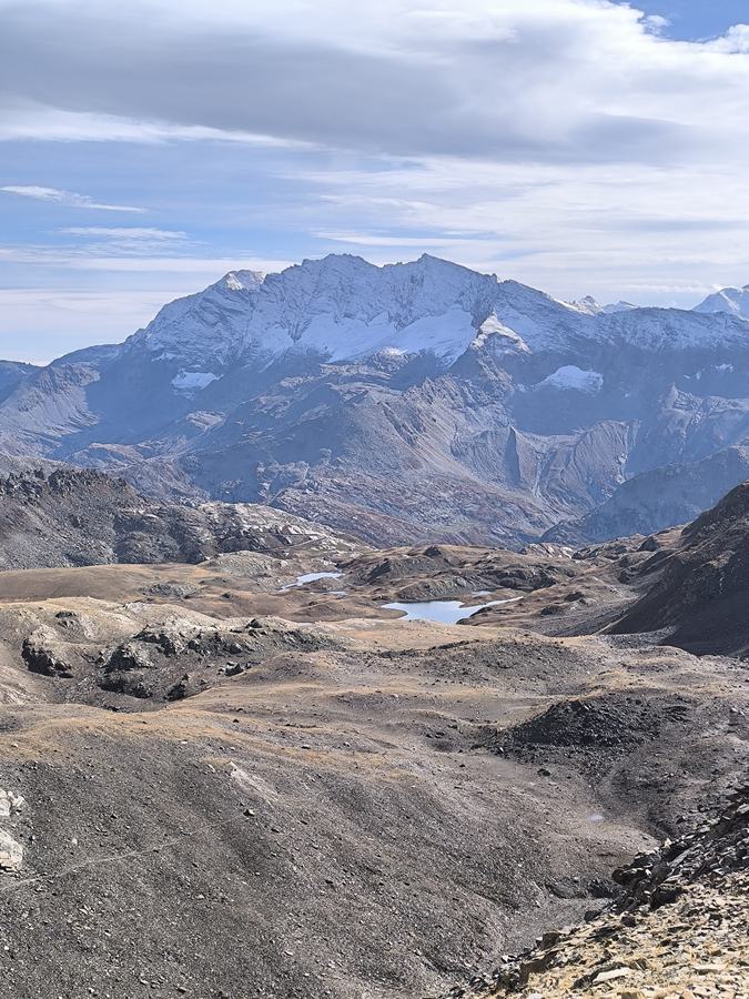 The snow-covered Gran Paradiso massif rising above the lake basin of the Plan del Nivolet