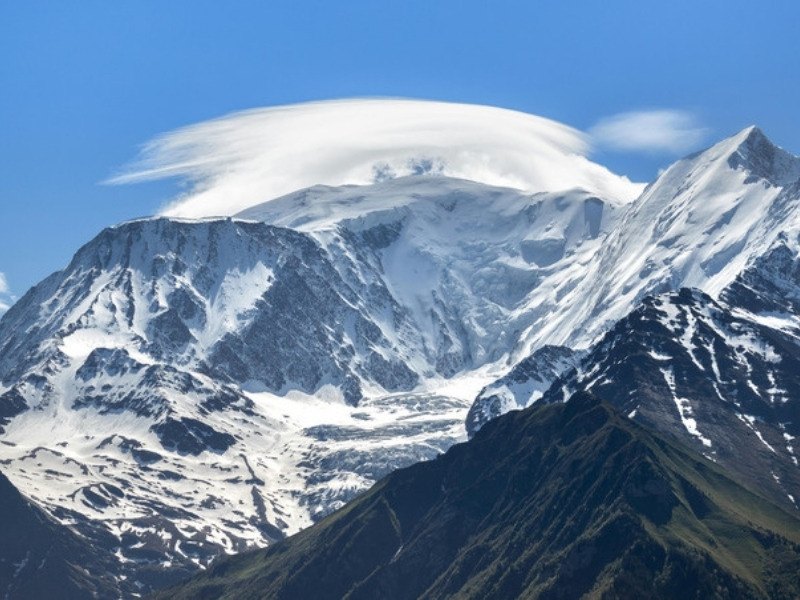 A lenticular cloud over the snow cap of Mont Blanc, the layer of snow and ice that makes its official height change every two years