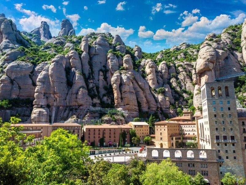 The Montserrat hiking trails climbing into the rock towers above the monastery in Catalonia, Spain