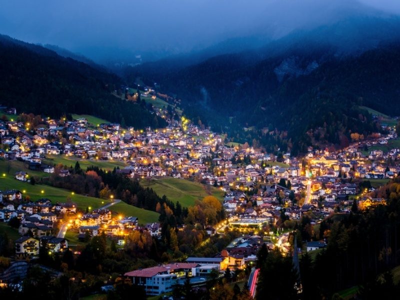 The center of Ortisei lit up at night, where most Ortisei hotels sit, Val Gardena, Dolomites, Italy