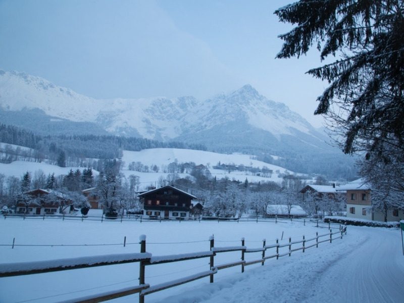 A snowy village below the Wilder Kaiser mountains in winter, near the hotels in Scheffau, Austria